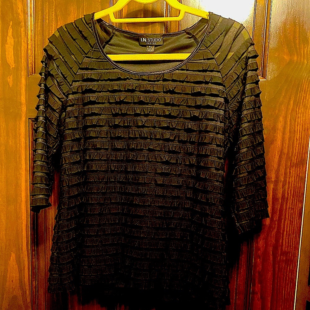 A Petite Black Ruffle top